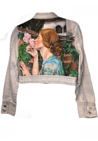 a denim jacket with a painting of a woman kissing a rose
